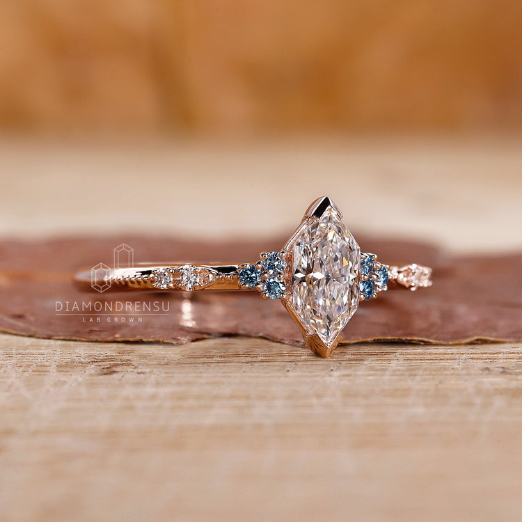 Round cut side stones in handmade ring.