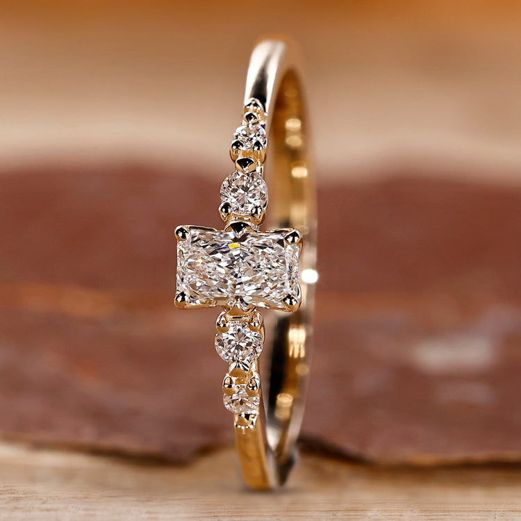 Yellow gold radiant cut engagement ring design.