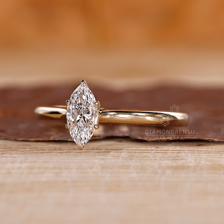 Tapered shank band in marquise diamond engagement ring.
