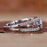 Handmade east west engagement ring with split pave shank band.