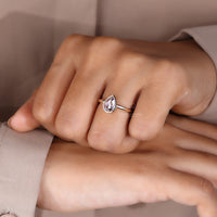 Bezel set diamond ring in Yellow gold finish.