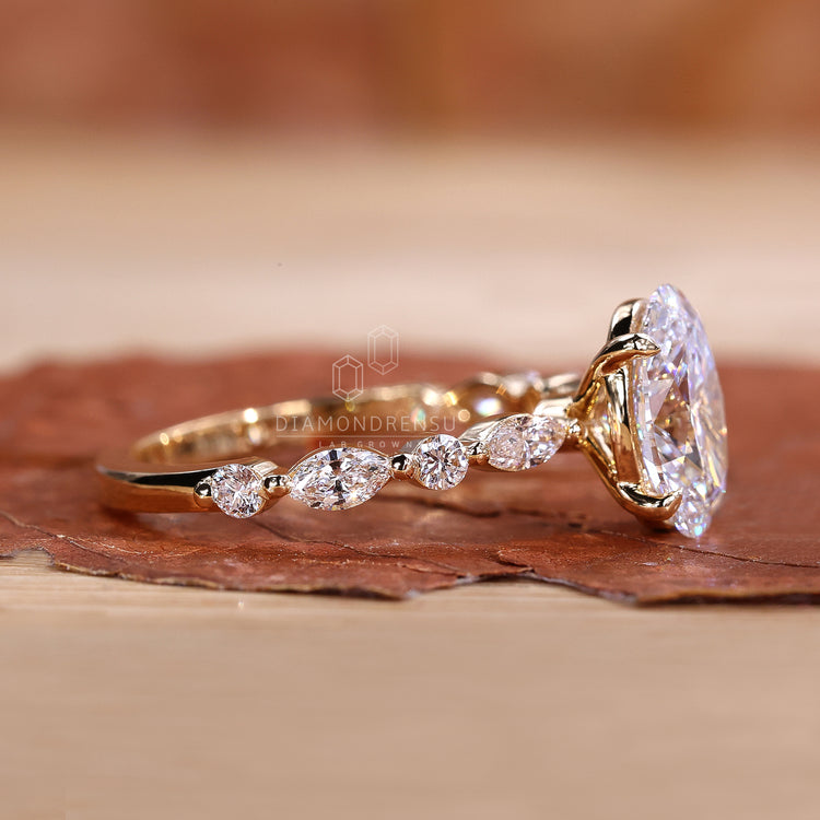 Custom oval diamond ring with split shank setting.