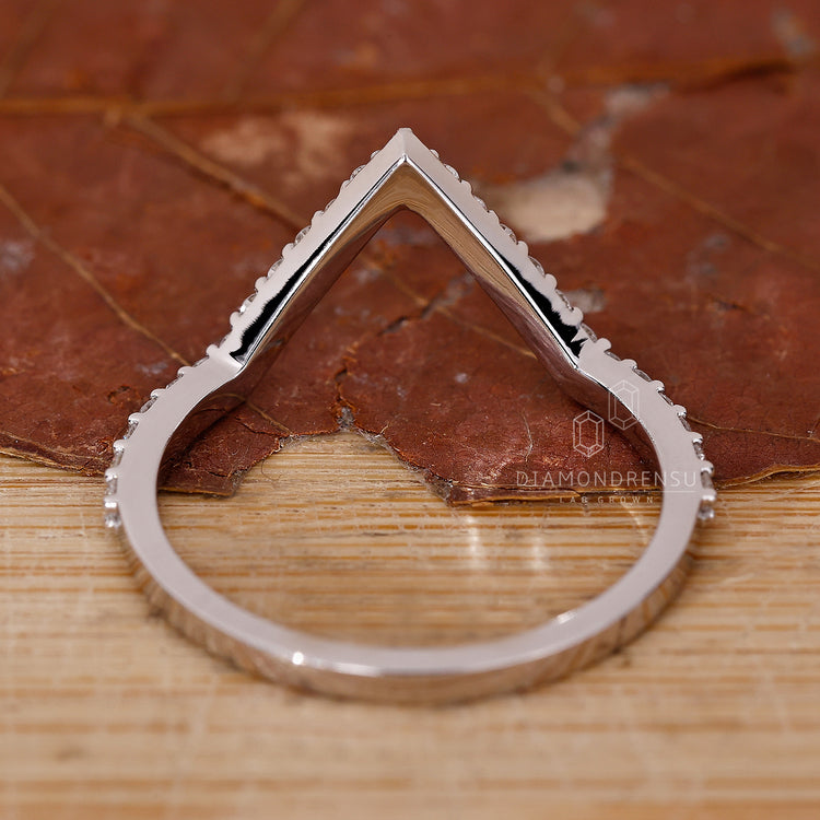 Contour band with lab grown diamonds.