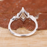 white gold engagement ring with v prong setting.