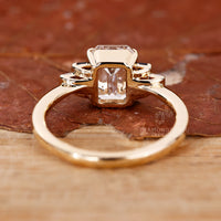 Yellow gold diamond ring with blue sapphire baguette stones.