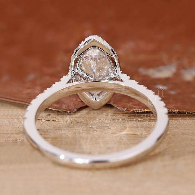 Prong setting halo diamond engagement ring.