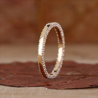 Double row diamond band with brilliant round cut stones.