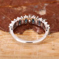 Marquise and baguette diamond half eternity band.