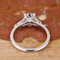 Buy engagement ring with Portuguese cut centre and side stones.