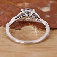 Buy engagement ring with Portuguese cut solitaire diamond and custom twist shank.