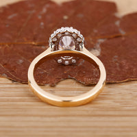 Yellow gold halo diamond engagement ring.