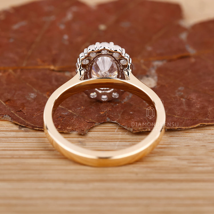 Yellow gold halo diamond engagement ring.