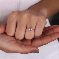 Double claw prong setting on a yellow gold engagement ring.