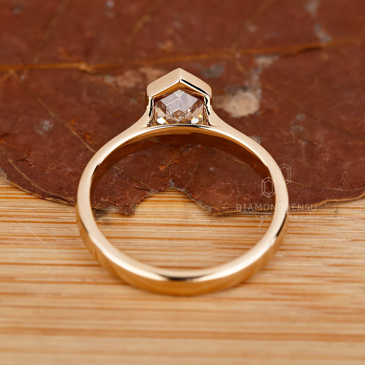Unique hexagon cut diamond engagement ring.