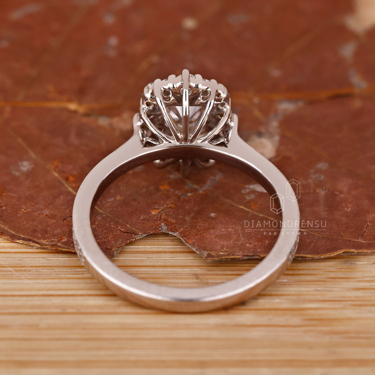 Pave Setting Ring in white gold with round side stones.