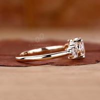 Muse setting ring paired with marquise and round side stone.