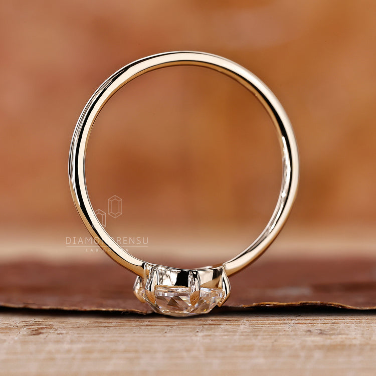 IGI certified diamond placed in yellow gold diamond ring.