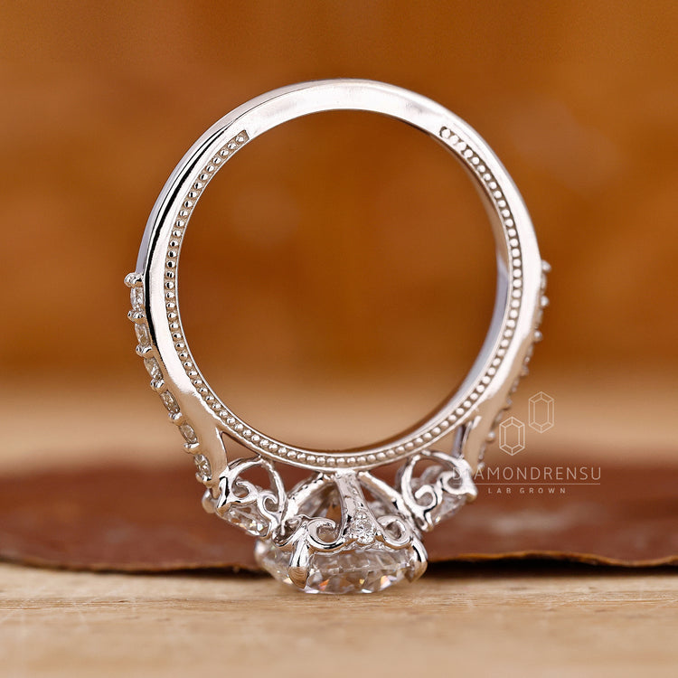 Buy engagement ring with 3 stones and classic pavé design.