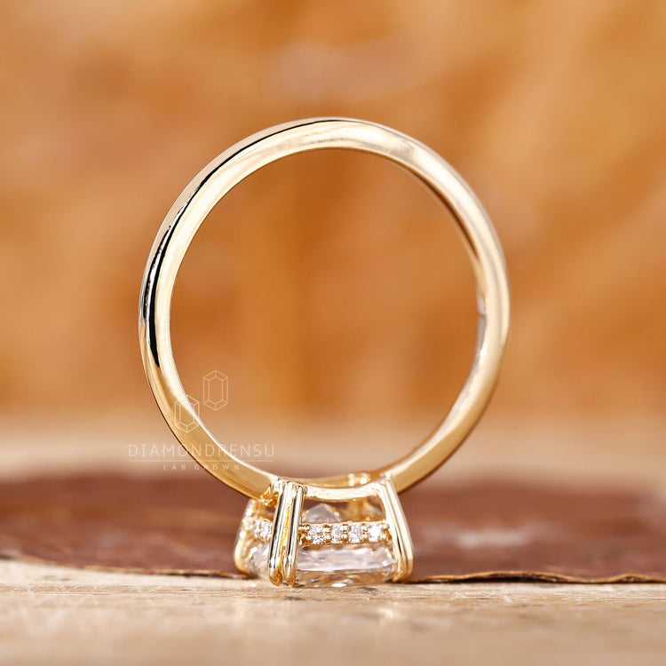 Buy engagement ring with cushion cut and hidden halo in yellow gold.