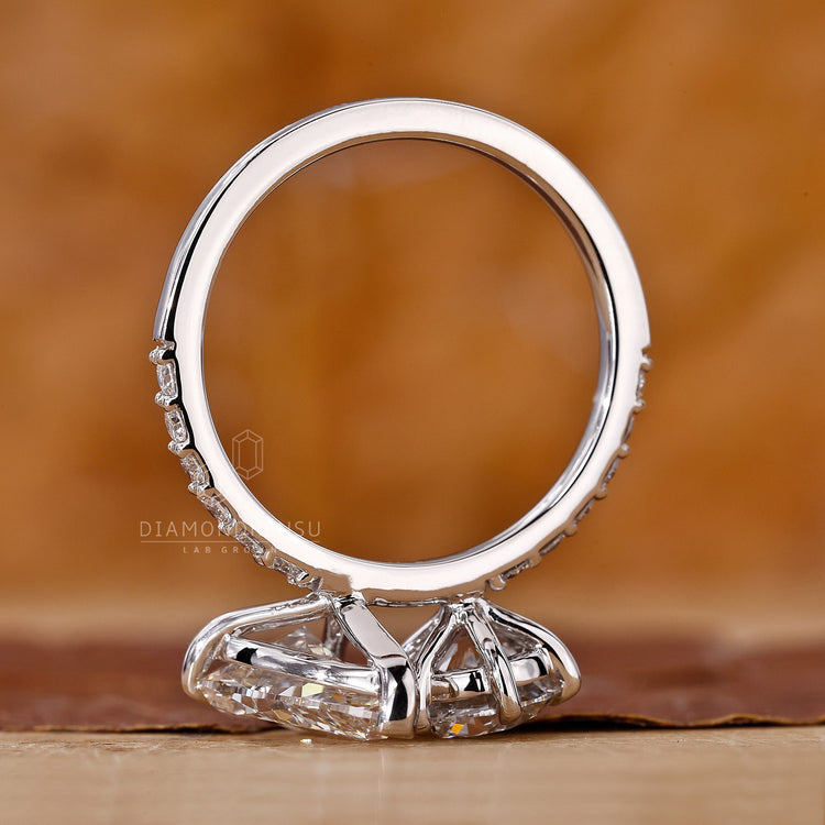 Buy engagement ring with pear and round lab grown diamonds.