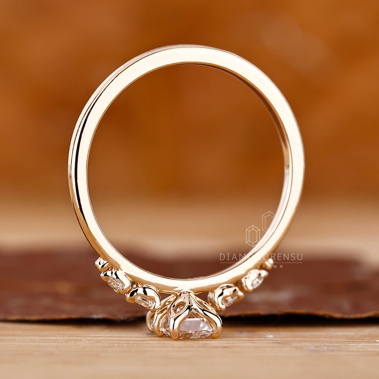 4 Prong Ring holding a lab grown emerald cut diamond.