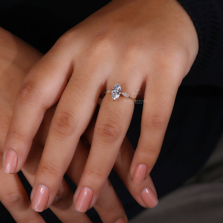 Yellow gold engagement ring with three stone layout.