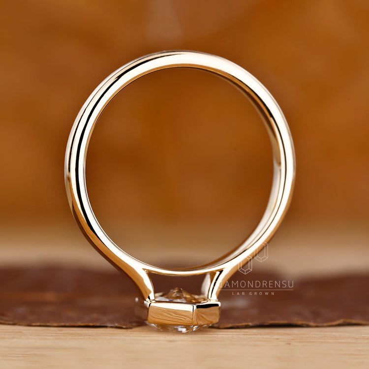 Lab grown hexagon cut diamond engagement ring.
