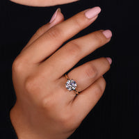 4 claw prong setting on simple engagement ring.