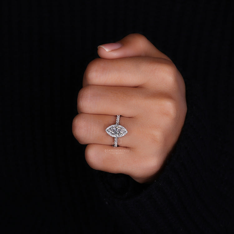 Round cut diamond ring with halo setting.