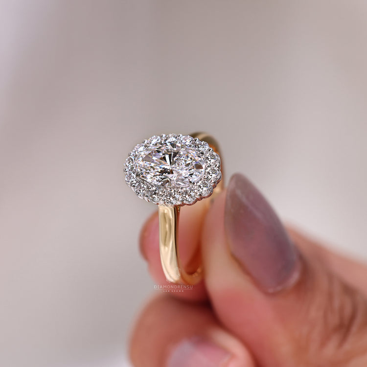 Halo diamond ring with cathedral setting.
