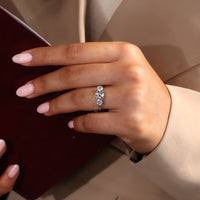 Round diamond ring designed with a handmade white gold band.