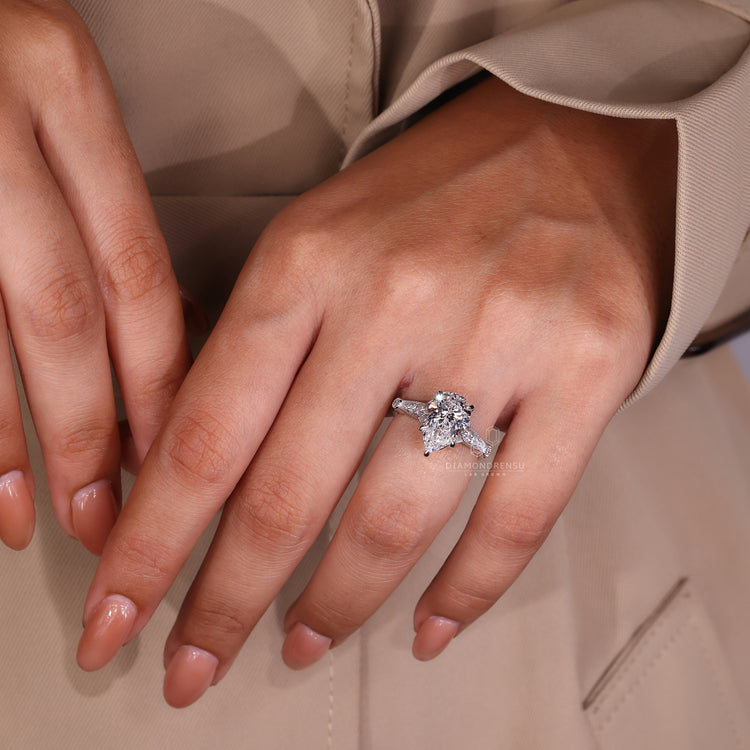 Customise ring with pear cut diamond and milgrain setting.