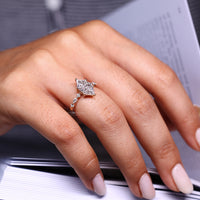 Seven Diamond Ring with Dutch marquise center and lab grown diamonds.