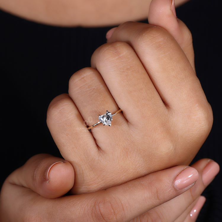 Solitaire engagement ring with heart centre diamond.
