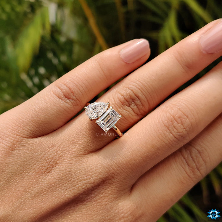 Emerald and pear cut ring in a unique and stunning design.
