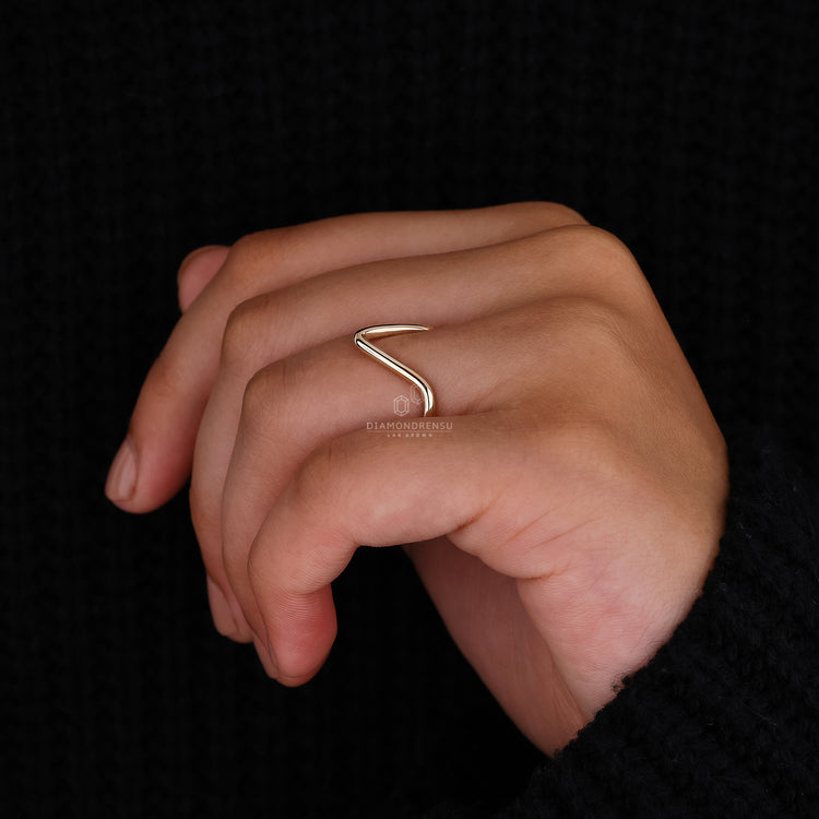 Wedding band with V shape design.