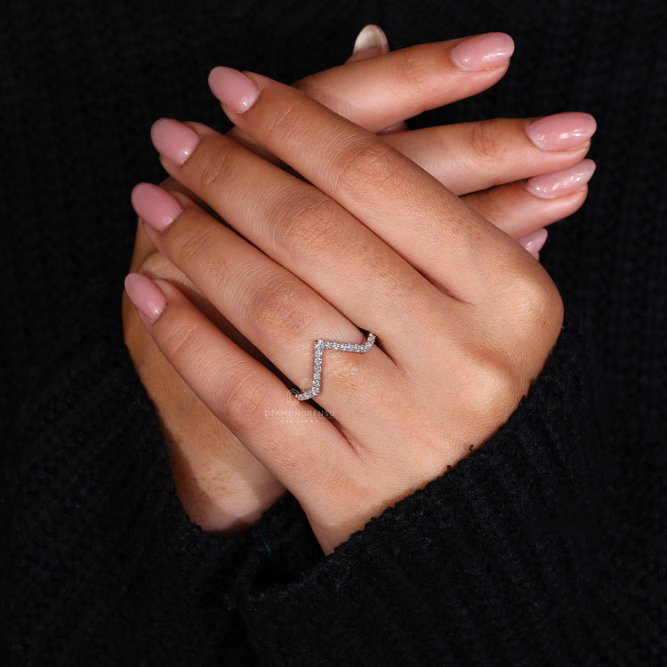 White gold chevron band with diamonds.