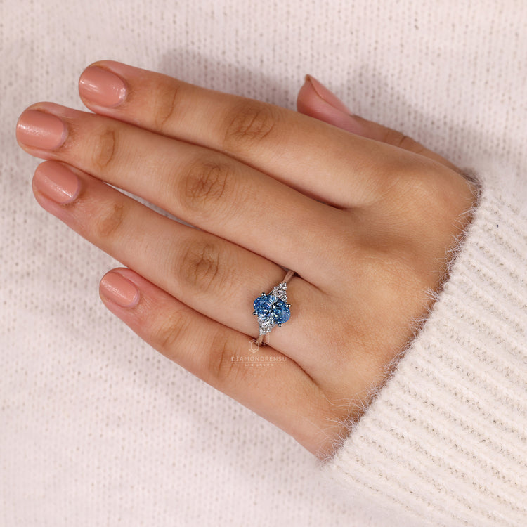 Customise ring with marquise and round side stone.