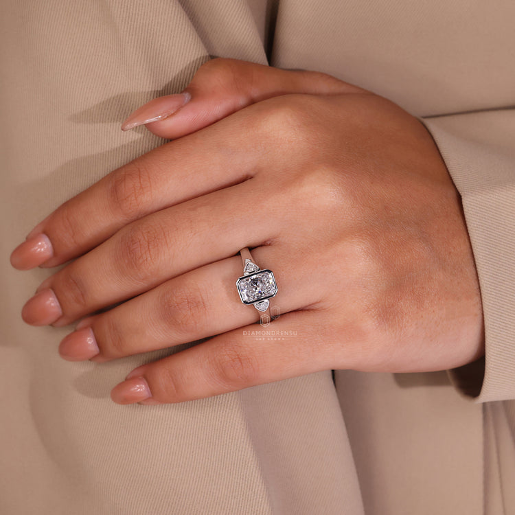 Customise ring with bezel set engagement ring.