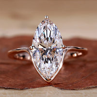 Marquise Diamond Engagement Ring with compass prong setting in rose gold.