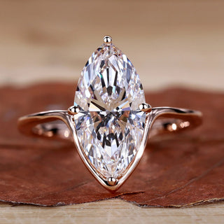Marquise Diamond Engagement Ring with compass prong setting in rose gold.