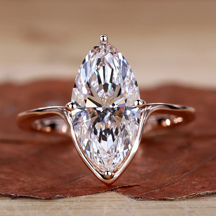 Marquise Diamond Engagement Ring with compass prong setting in rose gold.