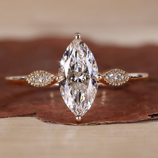 Marquise diamond engagement ring with elegant detailing.