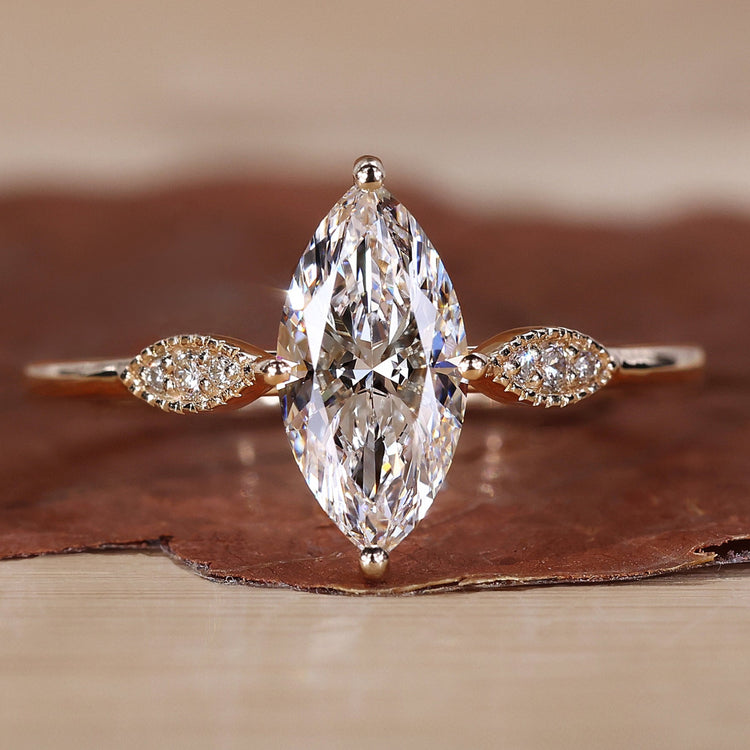 Marquise diamond engagement ring with elegant detailing.