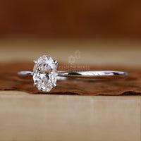 4 claw prong ring holding the oval diamond securely.