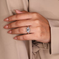 White gold ring with marquise diamond and east west setting.