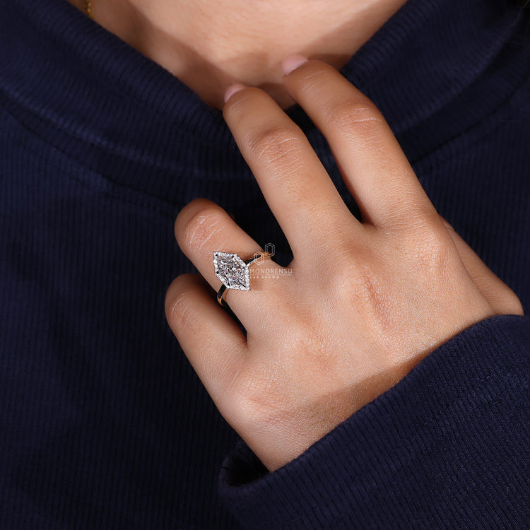 6 claw prong setting on round cut halo ring.