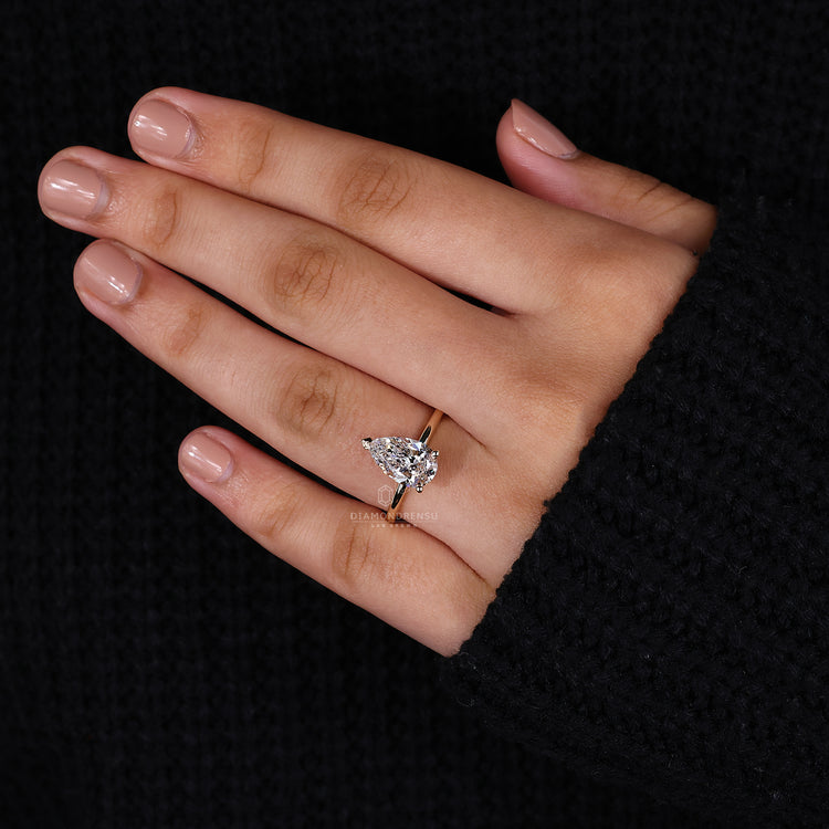 Custom pear diamond engagement ring design.