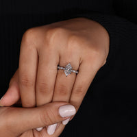 round cut side stones in Milgrain engagement ring.