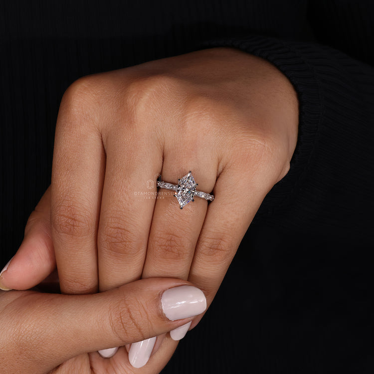 round cut side stones in Milgrain engagement ring.